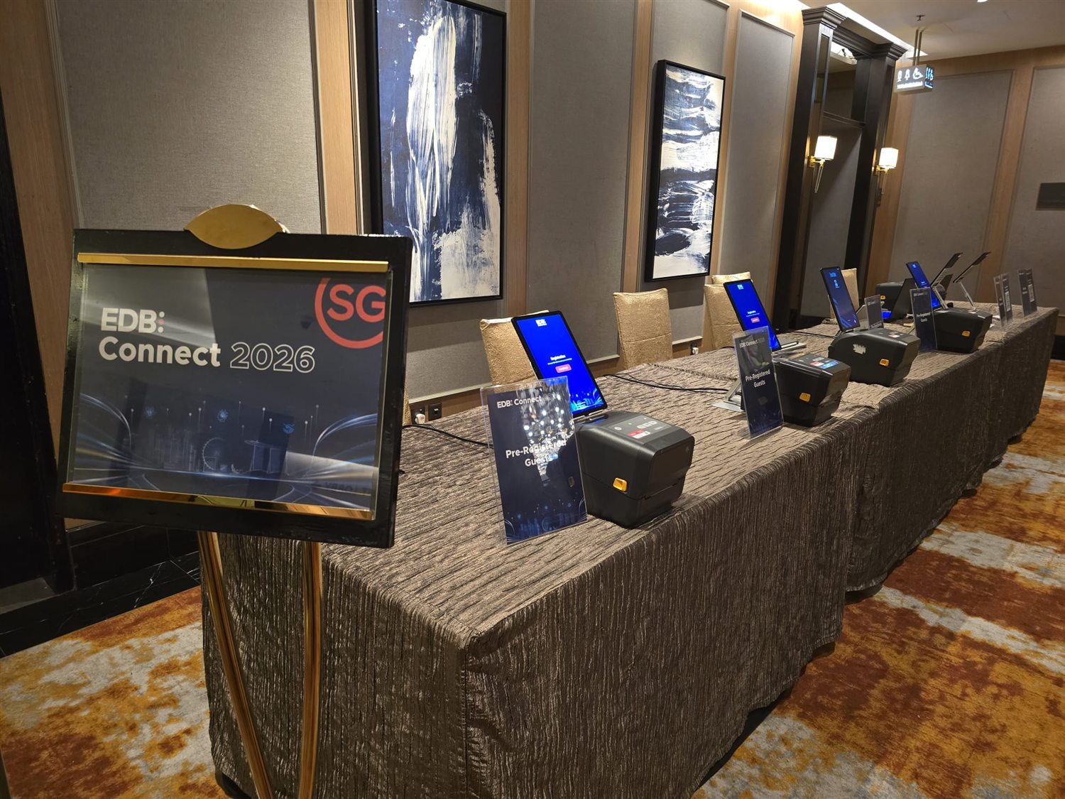 The registration desk and check-in kiosks at EDB Connect 2026